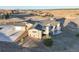 Aerial view of a modern house with a black roof at 19647 Guildford Ct, Monument, CO 80132