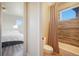 Bathroom and bedroom view featuring hardwood-style floor and bath/shower at 19647 Guildford Ct, Monument, CO 80132