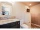Modern bathroom featuring a decorative backsplash, granite countertop, and herringbone-patterned tile in the shower at 19647 Guildford Ct, Monument, CO 80132