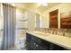 Modern bathroom with tiled shower, vanity and beautiful mirror at 19647 Guildford Ct, Monument, CO 80132