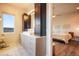 Modern bathroom with stylish vanity, sleek lighting, and a view of the bedroom at 19647 Guildford Ct, Monument, CO 80132