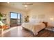 Bright and airy bedroom with a sliding glass door, hardwood floors, and modern decor at 19647 Guildford Ct, Monument, CO 80132
