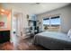 Bedroom featuring a large window with scenic view, computer and desk at 19647 Guildford Ct, Monument, CO 80132