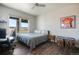 Bright bedroom featuring a large window with scenic view, desk and modern decor at 19647 Guildford Ct, Monument, CO 80132