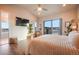 Spacious bedroom features a private balcony, sleek ceiling fan, and calming natural light at 19647 Guildford Ct, Monument, CO 80132