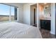 Bedroom view into an ensuite bathroom, featuring a large window with a scenic view at 19647 Guildford Ct, Monument, CO 80132