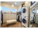 Spacious closet area with many shelves, drawers, and a washer and dryer at 19647 Guildford Ct, Monument, CO 80132