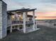 Exterior view of a modern home with a balcony overlooking a scenic landscape at 19647 Guildford Ct, Monument, CO 80132