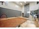 Indoor basketball court and rock climbing wall with ample lighting and high ceilings at 19647 Guildford Ct, Monument, CO 80132