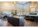 Open kitchen with a large island, modern appliances, and an adjacent dining area at 19647 Guildford Ct, Monument, CO 80132