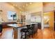 Bright, open kitchen features a large island, stainless steel appliances, and stylish lighting at 19647 Guildford Ct, Monument, CO 80132