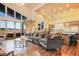 Open living space with high ceilings, natural light, hardwood floors and access to the balcony at 19647 Guildford Ct, Monument, CO 80132