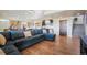 Relaxing living room with hardwood floors, built in cabinets and wet bar at 19647 Guildford Ct, Monument, CO 80132