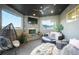 Cozy outdoor patio with stone fireplace, comfortable seating, and modern decor at 19647 Guildford Ct, Monument, CO 80132