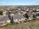 Aerial view of backyard showing a patio and outdoor seating area in a suburban neighborhood at 8501 Hackamore Rd, Littleton, CO 80125