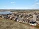 An aerial view of a neighborhood close to open spaces and featuring community ponds at 8501 Hackamore Rd, Littleton, CO 80125