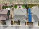 Aerial view of a well-maintained home featuring a backyard patio and solar panels at 8501 Hackamore Rd, Littleton, CO 80125