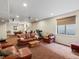 Open basement with plush seating area and a treadmill, perfect for lounging and fitness at 8501 Hackamore Rd, Littleton, CO 80125