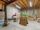Unfinished basement with exposed ceiling, concrete walls and floors providing ample storage or customization potential at 8501 Hackamore Rd, Littleton, CO 80125