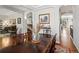 Formal dining room with an elegant dark wood table, seating for six, hardwood floors, and archways at 8501 Hackamore Rd, Littleton, CO 80125