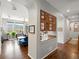 Hallway leading to the living area, with dark wood floors and cabinet storage at 8501 Hackamore Rd, Littleton, CO 80125