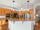 Kitchen with wooden cabinets, granite countertops, and a stainless steel oven and microwave at 8501 Hackamore Rd, Littleton, CO 80125