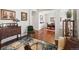 Elegant living room with hardwood floors, archways, and a view into the dining area at 8501 Hackamore Rd, Littleton, CO 80125