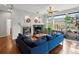 Living room with hardwood floors, a fireplace, and large windows at 8501 Hackamore Rd, Littleton, CO 80125