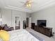 Expansive main bedroom suite with sitting area, TV console, and ensuite bath access at 8501 Hackamore Rd, Littleton, CO 80125