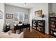 Home office with desk, hardwood floors, bookshelves, and a globe for decoration at 8501 Hackamore Rd, Littleton, CO 80125