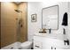 Modern bathroom with a glass-enclosed shower, sleek vanity, and stylish fixtures at 4647 Bryant St, Denver, CO 80211