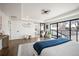 Bright and spacious bedroom with hardwood floors, large windows and neutral decor at 4647 Bryant St, Denver, CO 80211