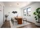 Bright dining room featuring an oval table, modern light fixture, and large windows at 4647 Bryant St, Denver, CO 80211