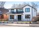 Charming two-story home boasting a modern design with manicured yard and fence at 4647 Bryant St, Denver, CO 80211