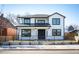 Beautiful two-story home featuring a modern farmhouse design with a manicured front lawn at 4647 Bryant St, Denver, CO 80211