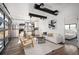 Open-concept living space with stainless steel kitchen, cozy seating area and connected to the bedroom at 4647 Bryant St, Denver, CO 80211
