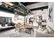 Open-concept space with kitchen, dining area and inviting living area that flows into an outdoor patio space at 4647 Bryant St, Denver, CO 80211