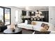 Comfortable living area featuring an open-concept design with dark kitchen cabinets at 4647 Bryant St, Denver, CO 80211