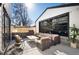 Outdoor patio with pizza oven, grill, and comfortable seating, perfect for entertaining friends and Gathering at 4647 Bryant St, Denver, CO 80211