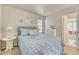 Cozy bedroom with a queen bed, window, and adjacent closet at 15726 E Otero Cir, Centennial, CO 80112