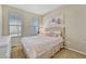 Bright bedroom with a double bed, neutral decor, and ample natural light at 15726 E Otero Cir, Centennial, CO 80112