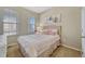 Cozy bedroom with a double bed, neutral decor, and ample natural light at 15726 E Otero Cir, Centennial, CO 80112