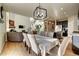 Bright dining area with a table, chairs, and view into the kitchen at 15726 E Otero Cir, Centennial, CO 80112