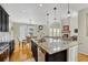 Modern kitchen with dark cabinetry, granite countertops, and island at 15726 E Otero Cir, Centennial, CO 80112