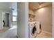 Convenient laundry room with washer and dryer, neatly tucked away at 15726 E Otero Cir, Centennial, CO 80112