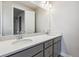 Bathroom with double sink vanity and large mirror at 1825 Morgan Dr, Erie, CO 80516