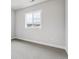 Neutral bedroom with carpet, base trim and a single window at 1825 Morgan Dr, Erie, CO 80516