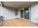 Spacious deck features wood flooring and a sliding glass door entry into the home's interior at 1825 Morgan Dr, Erie, CO 80516