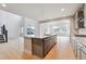 Elegant kitchen featuring stainless steel appliances, large island, and plenty of room to cook at 1825 Morgan Dr, Erie, CO 80516