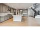 Spacious kitchen featuring gray cabinetry, a center island, and stainless steel appliances at 1825 Morgan Dr, Erie, CO 80516